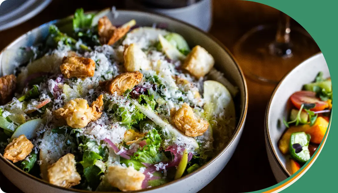 A bowl of food with broccoli and other vegetables.