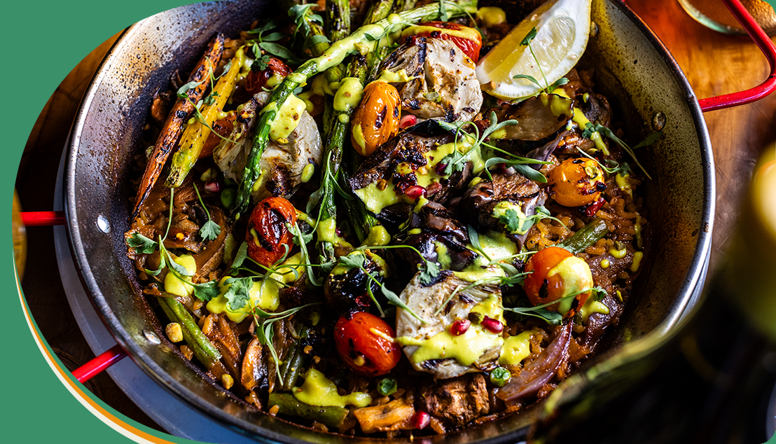 A pan of food with vegetables and meat.